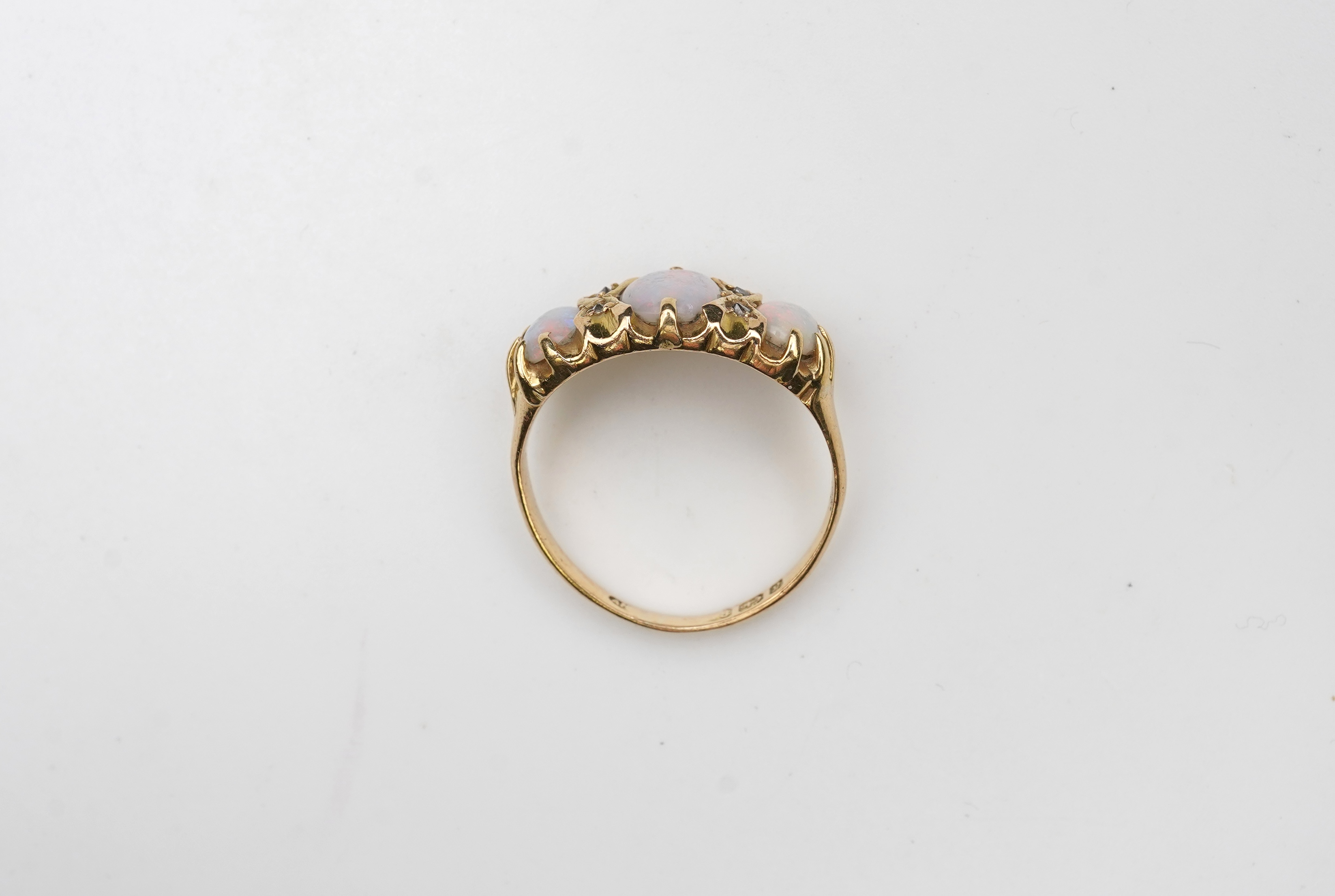 A Victorian 18ct gold and opal ring, circa 1898